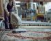 Professional carpet cleaning technician using a truck-mounted steam extractor to clean a living room rug in a Berkeley, California home.
