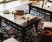 Detailed edge binding and stitched fabric border on custom bound carpet rugs over hardwood flooring.