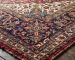 Specialist performing oriental rug cleaning safely using a low-moisture gentle wash on hand-knotted wool fibers.
